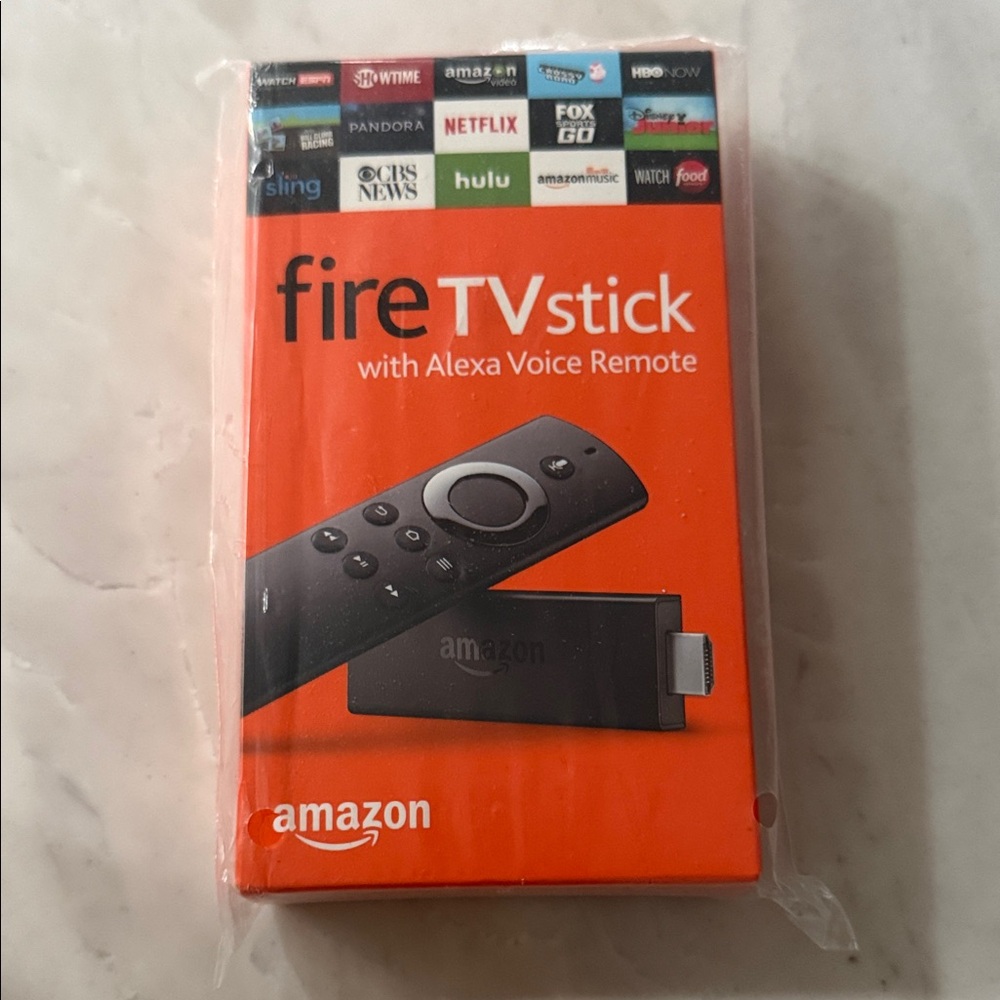 Amazon Fire TV Stick with Alexa Remote in Black and Orange